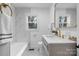 Bathroom with marble tile, gold fixtures, and a modern vanity at 1940 33Rd Ne Ave, Hickory, NC 28601