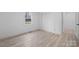 Simple bedroom with light wood floors and white walls at 1940 33Rd Ne Ave, Hickory, NC 28601