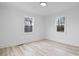 Bright bedroom featuring light wood flooring and large windows at 1940 33Rd Ne Ave, Hickory, NC 28601