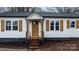 Newly renovated house featuring white siding, a brown door, and stylish shutters at 1940 33Rd Ne Ave, Hickory, NC 28601