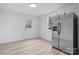 Stainless steel refrigerator in a kitchen with light wood floors at 1940 33Rd Ne Ave, Hickory, NC 28601