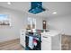 Modern kitchen island with blue range hood and white cabinets at 1940 33Rd Ne Ave, Hickory, NC 28601
