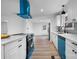 Modern kitchen with white cabinets, blue appliances, and marble countertops at 1940 33Rd Ne Ave, Hickory, NC 28601