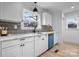 White kitchen features marble countertops and blue dishwasher at 1940 33Rd Ne Ave, Hickory, NC 28601