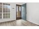 Inviting entryway featuring gray vinyl floors, a window with blinds, and a teal front door to the home at 1985 Lancer Ct, Gastonia, NC 28054