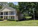 Inviting townhouse showcasing a quaint balcony and neat landscaping enhancing its curb appeal at 1985 Lancer Ct, Gastonia, NC 28054