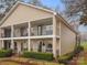 Tan two-story building with multiple units and balconies at 1985 Lancer Ct, Gastonia, NC 28054