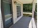 A covered porch featuring an exterior light, large windows, and a black metal railing offers a place to relax at 1985 Lancer Ct, Gastonia, NC 28054