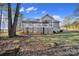 House exterior showcasing a deck, stairs, and wooded setting at 2045 Roadrunner Rd, Clover, SC 29710