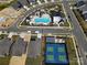 Aerial view of community amenities including a pool, tennis court, and clubhouse at 212 Portrait Way, Indian Trail, NC 28079