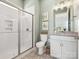 Bright bathroom featuring vanity with a framed mirror and a shower room at 212 Portrait Way, Indian Trail, NC 28079