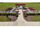 Aerial view of a community garden with plots and a tool shed for residents at 212 Portrait Way, Indian Trail, NC 28079