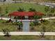 Aerial view of the community park featuring a pergola and walking paths through lush landscaping at 212 Portrait Way, Indian Trail, NC 28079