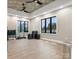 Spacious workout room with ample room for activities and floor to ceiling windows for plenty of natural light at 212 Portrait Way, Indian Trail, NC 28079