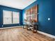 Office space with stylish decor, including a wood console table and interesting wall art at 212 Portrait Way, Indian Trail, NC 28079