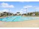 Community pool with plenty of seating and sun protection for a relaxing outdoor experience at 212 Portrait Way, Indian Trail, NC 28079