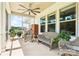 Relaxing screened-in porch with comfortable seating and views of the outdoors at 212 Portrait Way, Indian Trail, NC 28079