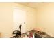 Functional bedroom featuring a chair, door and window at 2485 Nc Highway 109 S Hwy, Mount Gilead, NC 27306