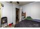 Plain bedroom features door, window, chair and basic furniture at 2485 Nc Highway 109 S Hwy, Mount Gilead, NC 27306