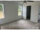 Spacious bedroom with neutral carpeting and two large windows at 285 E Steele St, Salisbury, NC 28144
