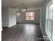 Open living area with hardwood floors, neutral walls, and ample natural light at 285 E Steele St, Salisbury, NC 28144