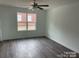 Bright living room with hardwood floors, neutral walls and a ceiling fan at 285 E Steele St, Salisbury, NC 28144