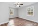 Well-lit bedroom featuring wood floors and ceiling fan at 307 E Old Highway 74 None, Monroe, NC 28112