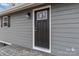 Black front door with glass accents and sidelights at 307 E Old Highway 74 None, Monroe, NC 28112