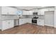 Modern white kitchen with granite countertops at 307 E Old Highway 74 None, Monroe, NC 28112