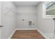 Laundry room with wire shelving and vinyl flooring at 307 E Old Highway 74 None, Monroe, NC 28112