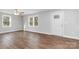 Living room with hardwood floors and ceiling fan at 307 E Old Highway 74 None, Monroe, NC 28112
