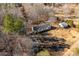 Aerial view of the property showcasing home and outbuildings at 360 Country Ridge Rd, Rockwell, NC 28138