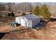 Metal building with garage door and tractor in yard at 360 Country Ridge Rd, Rockwell, NC 28138