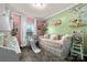 Charming bedroom with pink and green walls, a daybed, and playful decor at 360 Country Ridge Rd, Rockwell, NC 28138