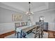 Bright dining room with hardwood floors and a lovely chandelier at 3735 Providence Manor Rd, Charlotte, NC 28270