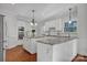 Large kitchen with granite countertops, white cabinets, and double ovens at 3735 Providence Manor Rd, Charlotte, NC 28270