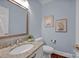 Stylish powder room with granite countertop and light blue walls at 3735 Providence Manor Rd, Charlotte, NC 28270