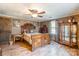 Bedroom with wooden bed frame and a glass-front cabinet at 375 W Rambo Rd, Rock Hill, SC 29730