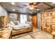 Rustic bedroom with a wooden bed frame and unique barn doors at 375 W Rambo Rd, Rock Hill, SC 29730