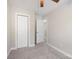 Charming bedroom with gray carpet, ceiling fan, and access to hallway at 3939 Newhall Dr, Hickory, NC 28601