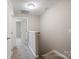 Upstairs hallway with carpet and access to bedrooms at 3939 Newhall Dr, Hickory, NC 28601