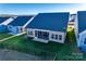 Aerial view showcasing home's backyard, screened porch and landscaping at 40196 Crooked Stick Dr, Lancaster, SC 29720