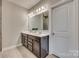 Elegant bathroom with double vanity and large mirror at 40196 Crooked Stick Dr, Lancaster, SC 29720