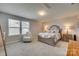 Bedroom with a queen-size bed and an armchair at 40196 Crooked Stick Dr, Lancaster, SC 29720