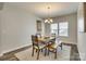 Spacious dining area with wooden table, bench, and chandelier at 40196 Crooked Stick Dr, Lancaster, SC 29720