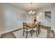 Bright dining room with hardwood floors and access to kitchen at 40196 Crooked Stick Dr, Lancaster, SC 29720