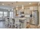 Modern kitchen with granite countertops, stainless steel appliances, and an island at 40196 Crooked Stick Dr, Lancaster, SC 29720
