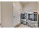 Laundry room with washer, dryer, and storage at 40196 Crooked Stick Dr, Lancaster, SC 29720