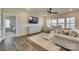 Relaxing living room with comfortable seating, large TV, and ceiling fan at 40196 Crooked Stick Dr, Lancaster, SC 29720