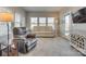 Relaxing sunroom with comfortable seating and access to backyard at 40196 Crooked Stick Dr, Lancaster, SC 29720